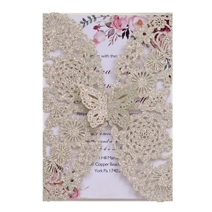 Detail of glitter rose gold laser cut wedding invitation with 3D butterfly design
