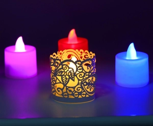 Detail of laser-cut leaf pattern on LED candle sleeves with four-color lighting effects