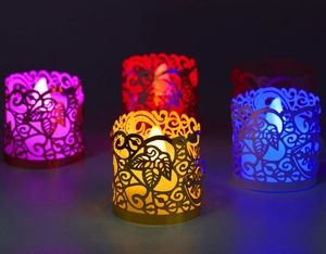 Macro shot of colorful laser-cut leaf pattern paper lanterns with LED candle light glow