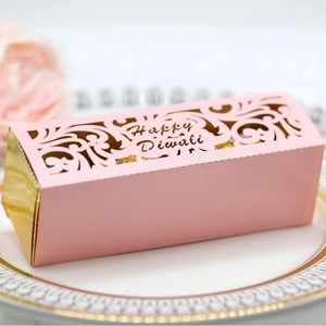 Pink laser cut Happy Diwali gift box with gold trim and elegant floral patterns