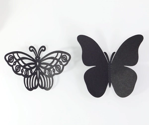 Vue détaillée de stickers muraux papillons noirs 3D avec motifs ajourés et pleins