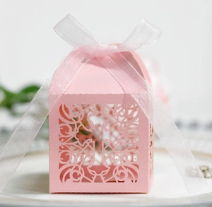 Pink laser cut cross candy box with white ribbon for weddings and religious parties