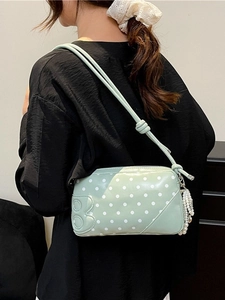 Mint green polka dot shoulder bag with embossed B letter and pearl charm accessory