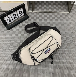 Detail of durable nylon crossbody chest bag with adjustable strap and buckle closure