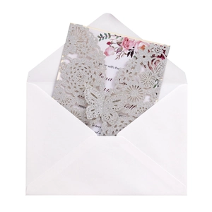 Detail showing laser-cut silver glitter butterfly sleeve and floral insert card with envelope