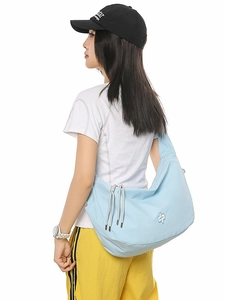 Minimalist blue checkered crescent crossbody bag with side drawstring details and zip closure