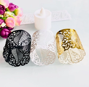 Hollow laser-cut decorative wraps in black white and gold for LED tea lights