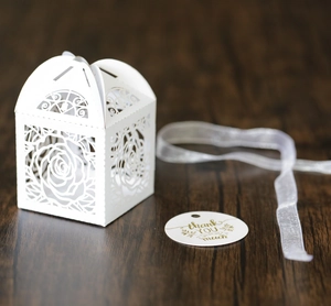 Detailed laser-cut rose hollow favor box with white ribbon and thank you tag for weddings