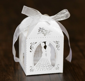 Elegant laser cut white paper wedding favor box with bride groom design and ribbon