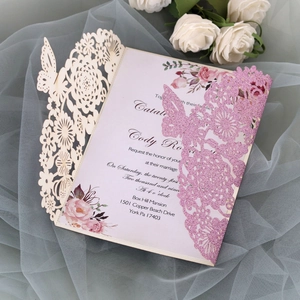 Detailed laser cut lace wedding invitation with glitter finish and butterfly floral patterns