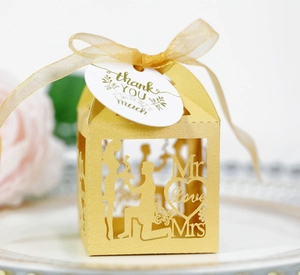Detailed laser-cut gold wedding favor box with Love hearts and thank you tag