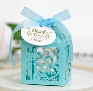 Detailed laser-cut light blue wedding favor box with Love design and thank you tag