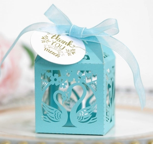 Laser-cut swan heart wedding favor box in light blue with ribbon and thank you tag