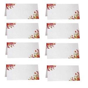 Detail view of 8 foldable white paper place cards with autumn leaf and berry print