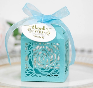Hollow rose cutout gift box in light blue with ribbon and thank you tag for weddings