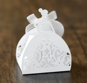 Detailed laser-cut bridal dress silhouette candy box with white silk ribbon bow decor