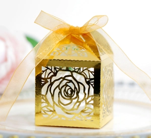 Laser-cut gold mirror paper gift box with rose pattern and gold organza ribbon bow