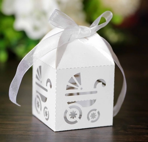 Detailed laser-cut baby carriage candy box with elegant white organza ribbon bow