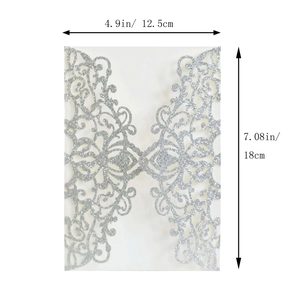 Detailed laser cut silver glitter wedding invitation cover measuring 12.5cm by 18cm