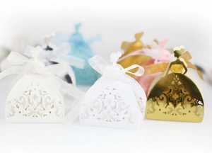 Laser cut gift boxes in elegant dress shape with ribbon for wedding party favors