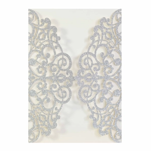 Intricate laser cut silver glitter wedding invitation card with floral scroll patterns