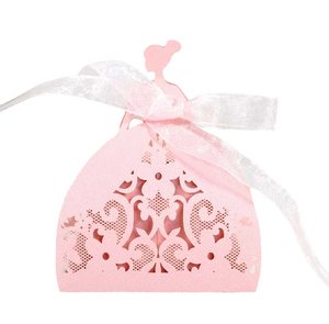 Pink laser cut favor box shaped like a princess dress with elegant ribbon for parties