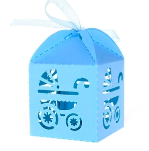 Macro detail of a laser-cut light blue candy box with a baby stroller design and ribbon