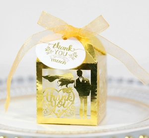 Elegant gold laser-cut wedding favor box with thank you tag and yellow chiffon ribbon