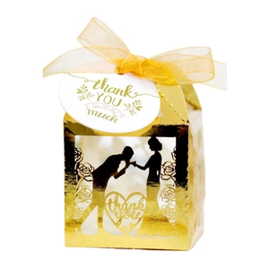 Golden laser-cut hollow wedding favor box with heart silhouette and thank you tag