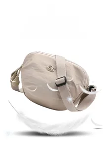 Lightweight cream crossbody saddle bag with large compartments and adjustable strap