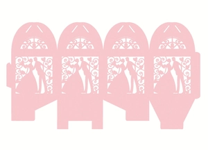 Flat lay of pink laser-cut wedding candy box template with bride and groom silhouette