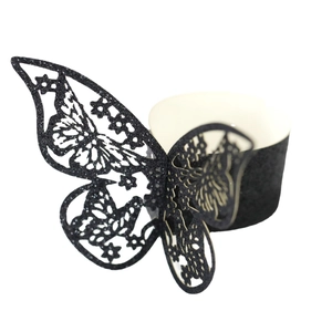 Elegantes servilleteros de mariposa negra con purpurina para decoración de banquetes