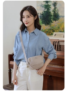 Beige nylon crossbody bag styled on a model for a chic and casual everyday fashion look