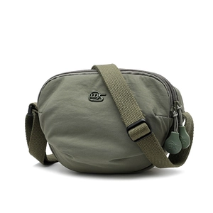 Detail of army green nylon saddle bag showing waterproof fabric and metal logo plate