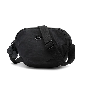 Close-up of black nylon saddle crossbody bag with silver metal logo and zip detailing