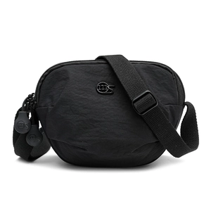 Detail of black nylon saddle bag featuring metal MS logo and adjustable fabric strap
