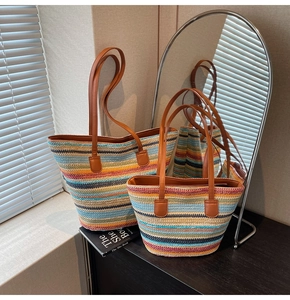 Detail of colorful woven tote bags in two sizes with brown leather shoulder straps