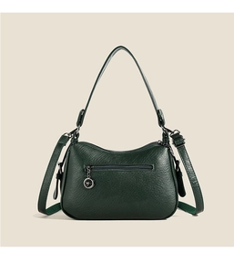 Detail of dark green lychee texture leather shoulder bag with gold kangaroo logo pendant