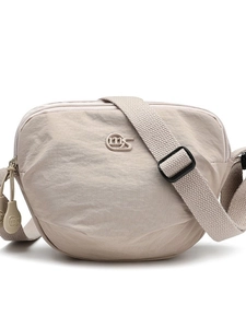 Fashionable beige nylon saddle crossbody bag with multiple zippers and wide strap