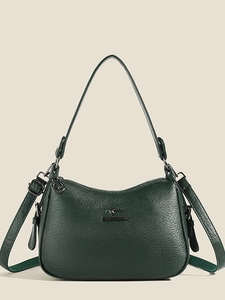 Minimalist dark green pebbled leather shoulder bag with kangaroo logo and dual straps