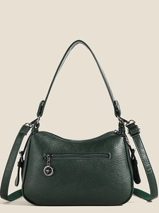 Green faux leather shoulder bag with lychee texture and metallic kangaroo charm