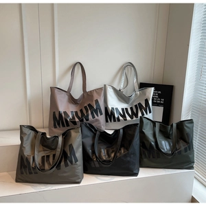 Tote bags collection in five colors with large MNWM print on durable nylon fabric
