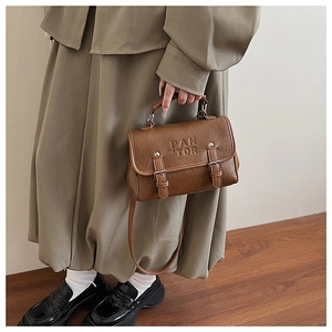 Brown vintage PU leather crossbody bag with dual buckle design and top handle