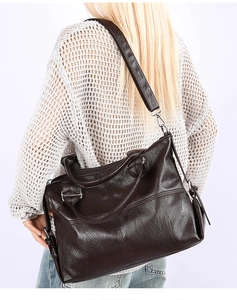 Fashion dark brown tote bag with pebble texture and detachable shoulder strap on model