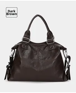 Detail view of large dark brown tote bag with retro pleated texture and silver buckles