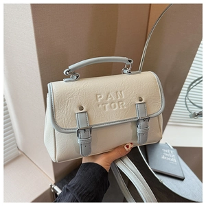 Detail of the vintage cream and light blue crossbody bag with pleated synthetic leather