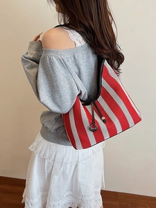 Striped knit hobo shoulder bag for women with red and white patterns and black piping