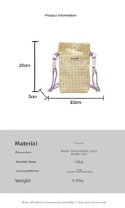 Detail view of yellow checkered fabric phone bag with dimensions and purple strap