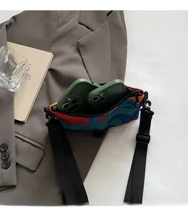 Detailed interior of color-block crossbody bag holding two large smartphones