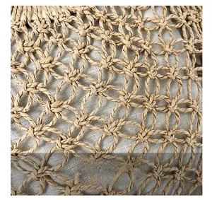 Detailed macro view of high-quality hollow woven texture and linen lining on handbag